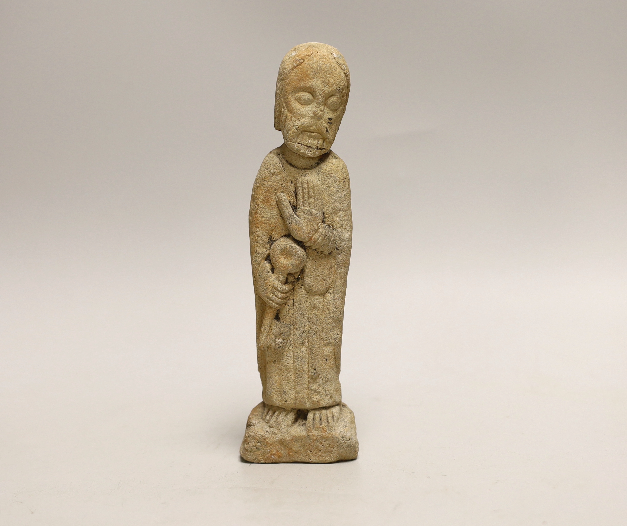 A limestone figure of Saint Peter, possibly Norman period 21cm